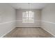 Dining room with chandelier and natural light coming through the window at 6181 E Fayetteville Dr, Riverdale, GA 30296