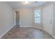 The living room features tile floors and a window for ample natural light at 6181 E Fayetteville Dr, Riverdale, GA 30296
