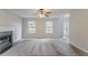 Spacious living room with a fireplace and a view of the front door at 6181 E Fayetteville Dr, Riverdale, GA 30296