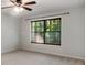 Neutral bedroom features large window offering views of mature trees and foliage at 1404 N Crossing Ne Dr, Atlanta, GA 30329