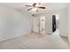 Bright and spacious bedroom with neutral carpet, ceiling fan, and large doorways at 1404 N Crossing Ne Dr, Atlanta, GA 30329