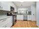 Bright kitchen featuring stainless steel appliances, hardwood floors and sleek cabinetry at 1404 N Crossing Ne Dr, Atlanta, GA 30329