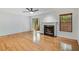 Cozy living room with fireplace, plush seating, and natural light from the sliding glass door at 1404 N Crossing Ne Dr, Atlanta, GA 30329
