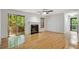 Bright living room with hardwood floors, a fireplace, and access to outdoor space at 1404 N Crossing Ne Dr, Atlanta, GA 30329