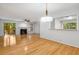 Spacious living room with hardwood floors, fireplace, and access to a deck through sliding glass doors at 1404 N Crossing Ne Dr, Atlanta, GA 30329