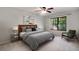 Relaxing bedroom with a cozy bed, window view, and carpeted floor at 1404 N Crossing Ne Dr, Atlanta, GA 30329