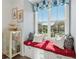 Cozy breakfast nook with a window seat and custom cushions offering a view of the neighborhood at 1621 Wellborn Walk, Suwanee, GA 30024