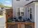 Cozy deck features comfortable seating, plants, and privacy fencing at 1621 Wellborn Walk, Suwanee, GA 30024