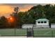 Community athletic field at sunset, with bleachers and a press box visible at 1621 Wellborn Walk, Suwanee, GA 30024