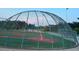Community baseball field with covered batting cages and a playground in the background at 1621 Wellborn Walk, Suwanee, GA 30024