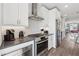 Modern kitchen featuring stainless steel appliances, stone countertops, and white subway tile backsplash at 1621 Wellborn Walk, Suwanee, GA 30024