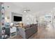 Open-concept living space featuring modern furnishings and seamless flow to the kitchen at 1621 Wellborn Walk, Suwanee, GA 30024