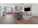Spacious living room featuring hardwood floors, comfortable seating, and a television at 1621 Wellborn Walk, Suwanee, GA 30024