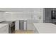 Modern kitchen featuring stainless steel appliances, white cabinets, and sleek countertops, offering a clean and stylish design at 560 Dutch Vly # 02313, Atlanta, GA 30324