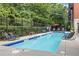 Refreshing outdoor pool area with lounge chairs and lush greenery, perfect for relaxation at 560 Dutch Vly # 02313, Atlanta, GA 30324