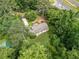 Charming home nestled among mature trees, highlighting the peaceful and private backyard setting at 5706 Forest Pl, Acworth, GA 30102