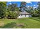 View of the home's backyard and back exterior at 5706 Forest Pl, Acworth, GA 30102