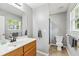 Bathroom featuring a vanity with a large mirror and a walk-in shower at 5706 Forest Pl, Acworth, GA 30102