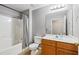 This bathroom features a shower/tub combo and wooden vanity at 5706 Forest Pl, Acworth, GA 30102