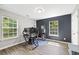 Bedroom featuring wood-look flooring, and two windows at 5706 Forest Pl, Acworth, GA 30102