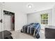 Well-lit bedroom with closet space and backyard window view for natural light at 5706 Forest Pl, Acworth, GA 30102