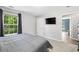 Spacious bedroom with large window, carpet, and adjacent closet and ensuite access at 5706 Forest Pl, Acworth, GA 30102