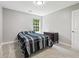 Spare bedroom featuring plush carpeting, double closet and natural light at 5706 Forest Pl, Acworth, GA 30102
