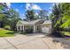Charming single-story home with manicured lawn, mature trees, and an attached one-car garage at 5706 Forest Pl, Acworth, GA 30102