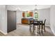 Eat-in kitchen with stainless appliances, wood cabinets, and an adjacent dining area at 5706 Forest Pl, Acworth, GA 30102