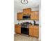 The kitchen has wood cabinets and stainless steel appliances at 5706 Forest Pl, Acworth, GA 30102