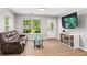 Cozy living room with tiled floors, natural light, and a decorative front door at 5706 Forest Pl, Acworth, GA 30102