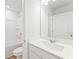 Bright bathroom showcases a shower-tub combo, a white vanity, and a commode at 2058 Brookhill Way, Snellville, GA 30078