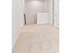 Bright hallway featuring neutral carpet and paint at 2058 Brookhill Way, Snellville, GA 30078