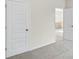 Bedroom with two doors, carpet flooring and a view towards the staircase landing at 1225 Elowen Dr, Austell, GA 30168