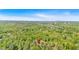 Aerial view of a property nestled in a wooded area, showcasing its serene and private setting in a natural environment at 144 Cathy Ln, Hiram, GA 30141
