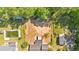Aerial view of the property highlighting its spacious layout, pool, and convenient access to surrounding amenities at 144 Cathy Ln, Hiram, GA 30141