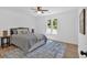 Serene bedroom with ample natural light, soft colors, and plush bedding for a relaxing retreat at 144 Cathy Ln, Hiram, GA 30141