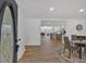 Bright entryway with open floor plan, hardwood floors, and view of the kitchen and living spaces at 144 Cathy Ln, Hiram, GA 30141