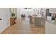 Modern, open-concept kitchen with stainless steel appliances, a large island, and easy access to the living area at 144 Cathy Ln, Hiram, GA 30141