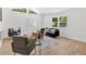 Inviting living room featuring modern seating, a large window, and neutral colors at 144 Cathy Ln, Hiram, GA 30141