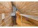Unfinished attic with wood paneling and chimney access at 407 E College E St, Bowdon, GA 30108