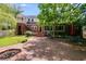 Backyard with patio, outdoor seating, and brick exterior at 407 E College E St, Bowdon, GA 30108