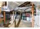 Spacious unfinished basement offering potential for storage or customization with exposed ductwork and concrete flooring at 407 E College E St, Bowdon, GA 30108