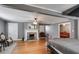 Spacious bedroom with fireplace, hardwood floors, and grey walls at 407 E College E St, Bowdon, GA 30108