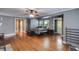 Bedroom boasts hardwood floors, a ceiling fan, and ample natural light at 407 E College E St, Bowdon, GA 30108