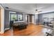 Bright bedroom with hardwood floors, ceiling fan, and multiple windows at 407 E College E St, Bowdon, GA 30108