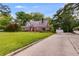 Charming brick home on a spacious lot featuring a driveway and a detached two-car garage at 407 E College E St, Bowdon, GA 30108