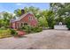 Charming brick home on a spacious lot featuring a driveway and a detached two-car garage at 407 E College E St, Bowdon, GA 30108