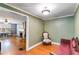 Cozy living room features hardwood floors and vintage furniture at 407 E College E St, Bowdon, GA 30108