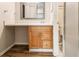 Bathroom with wood-look floors, vanity, drawers, and a mirror at 2039 Oak Park Ln, Decatur, GA 30032